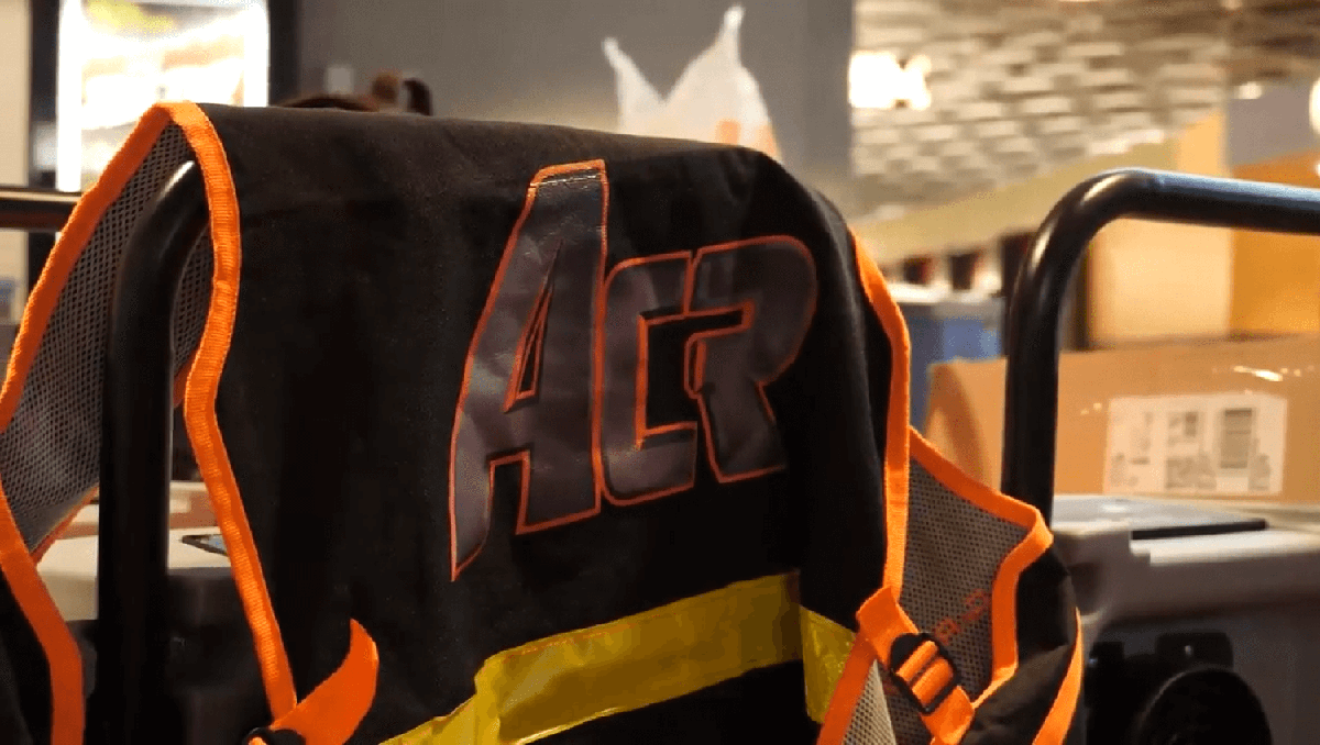 Closeup of an orange hazard vest embroidered with the ACR logo