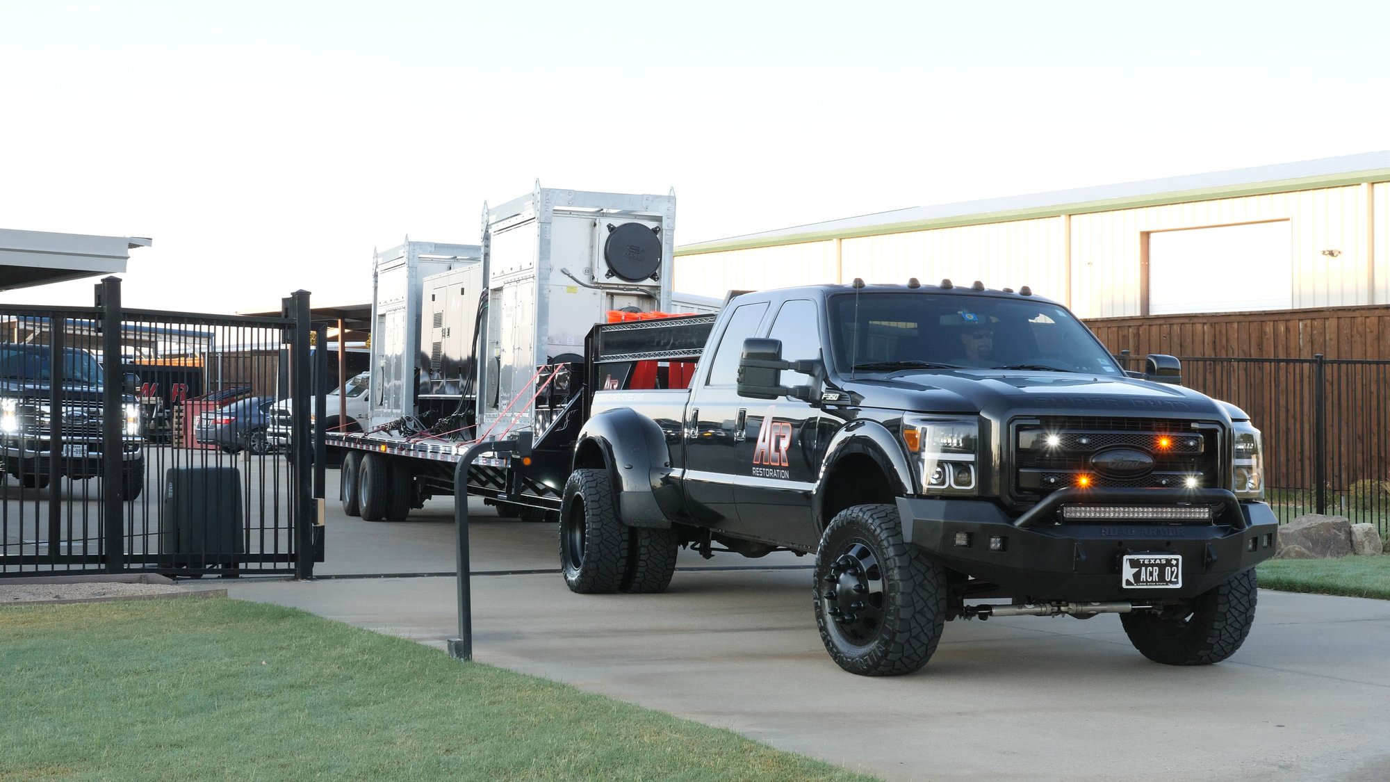A large ACR truck pulling a trailer full of supplies